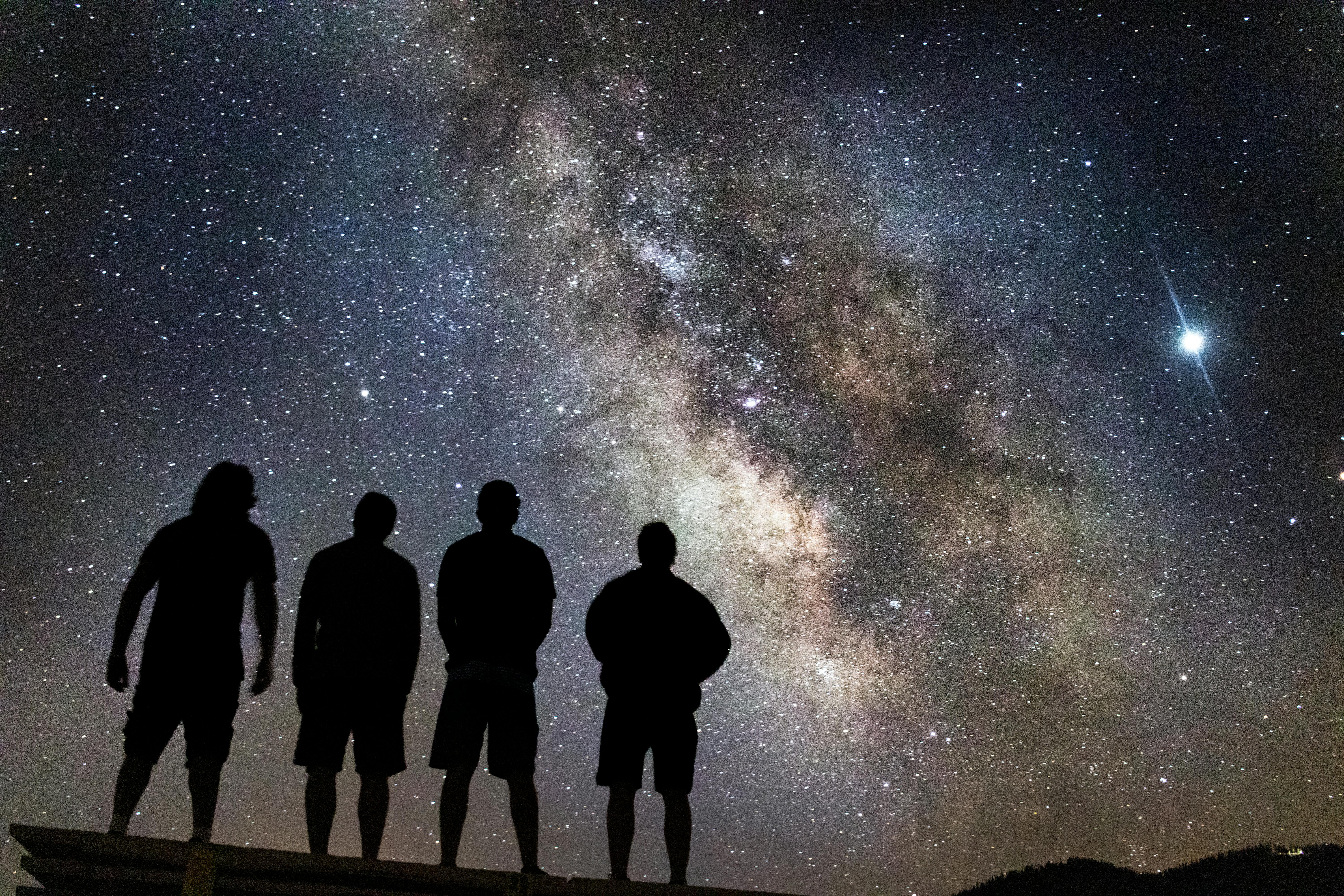 Picture of four people looking at space